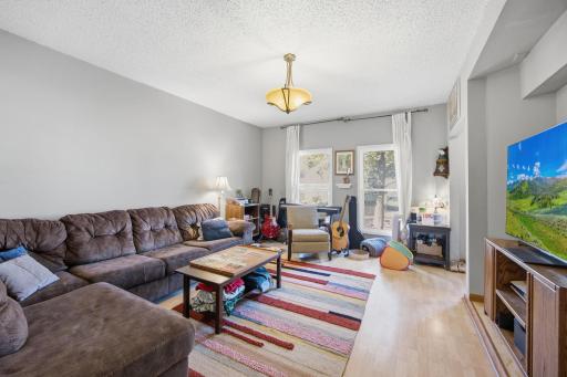 Front living room with newer windows. Front door to the right. Lot's of light from larger newer windows.