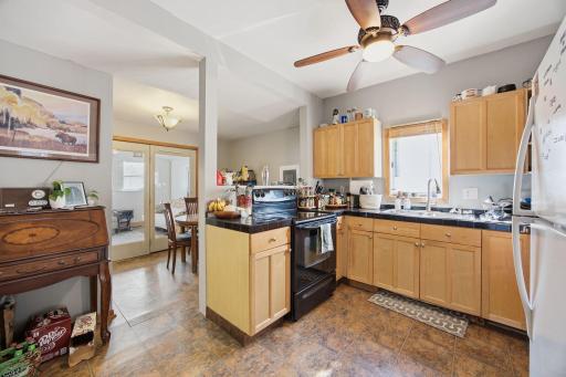 Open kitchen with spacious eat in area . That leads to the 3 season porch.