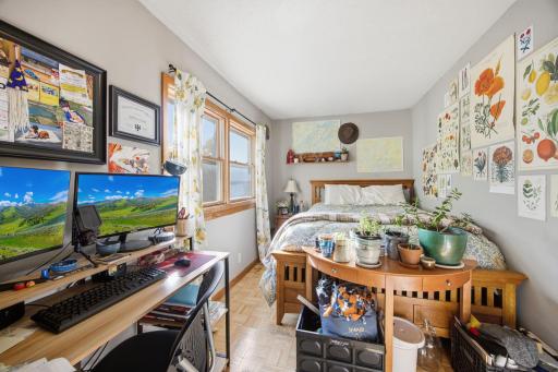 3 bedrooms and a full bathroom upstairs. This bedroom faces south over the back yard. Generous size closet and TV space behind.
