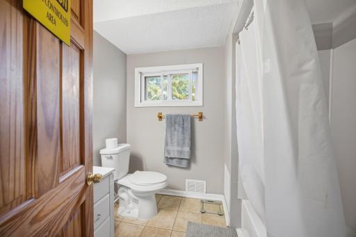 Upper full bathroom. New light fixture over sink. Fan light combo also to help remove humidity after showers. All doors are matching solid 6 panel wood doors.