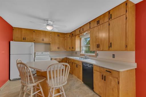 The kitchen offers ample cabinet space