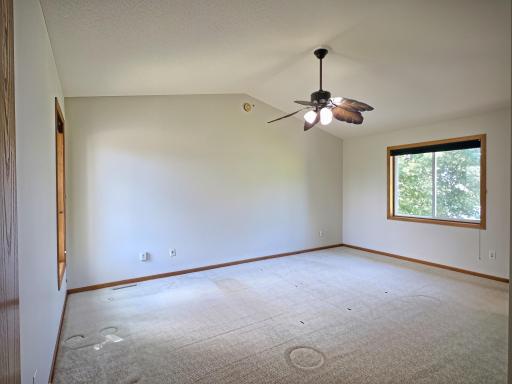 Spacious primary bedroom with a convenient pass-through to the bathroom. .
