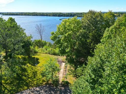 Mature trees surround the home and shoreline providing privacy and a peaceful setting, while enjoying beautiful lake views.