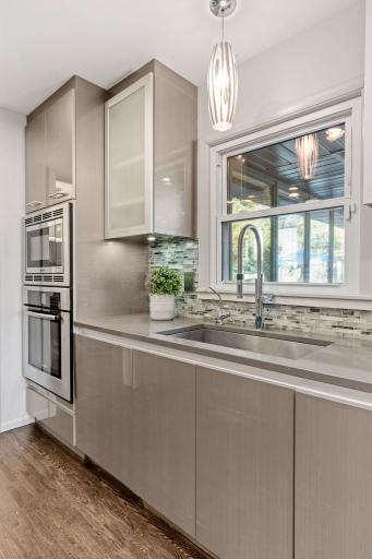 Stainless Steel Sink and Wall Mounted Microwave and Oven