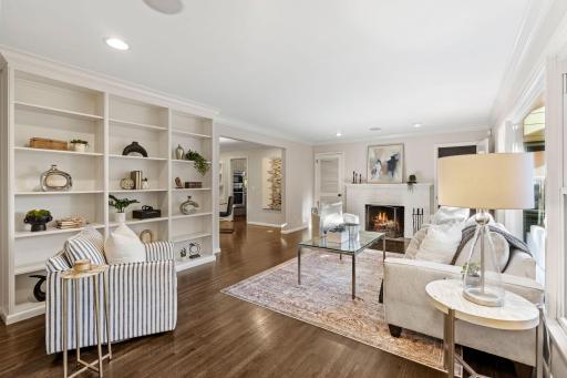 Main Level Living Room with Hardwood Floors, Built-Ins and Wood-Burning Fireplace
