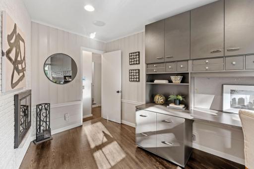Main Level Office with Wood-Burning Fireplace and Custom Built-In Desk