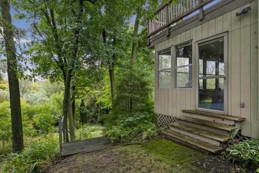 Porch with deck above, stairway down to backyard.