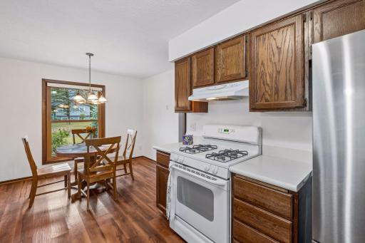 This wonderful, sun-filled eat-in kitchen offers a bright and welcoming space with a lovely view of the front yard.