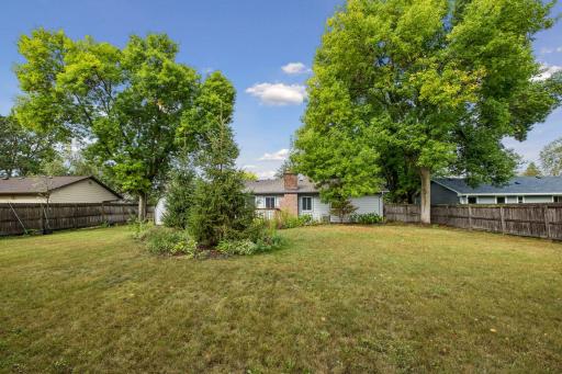 This amazing, fully fenced backyard offers plenty of space to run, play, entertain, and enjoy the outdoors.