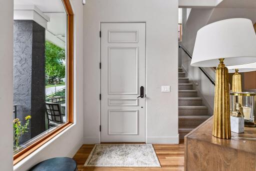 Step into this lovely entryway with soaring ceilings and an inviting main level