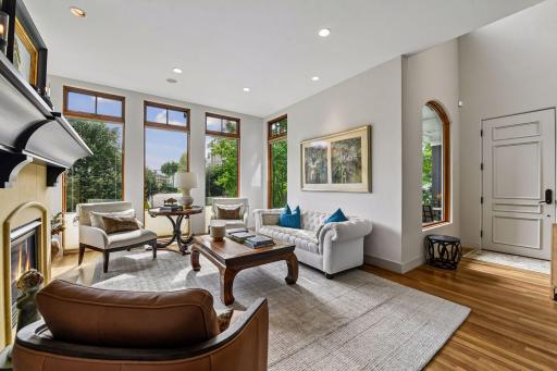 Cozy up by the elegant gas fireplace, the perfect centerpiece for warmth and ambiance paired with floor to ceiling windows.