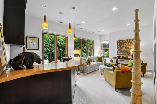 The lower level offers entertaining space, a wet bar, exercise room, and access to the walkout patio area