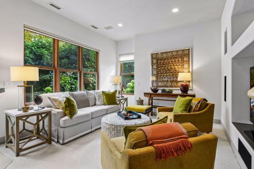 The lower level offers entertaining space, a wet bar, exercise room, and access to the walkout patio area