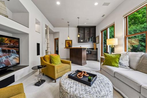 The lower level offers entertaining space, a wet bar, exercise room, and access to the walkout patio area