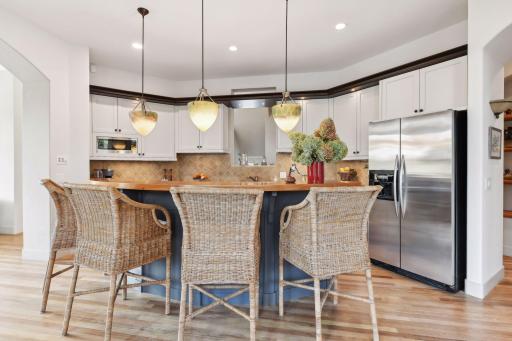 Beautiful Chef's kitchen with stainless steel appliances, large center island, and plenty of counter and cabinet space
