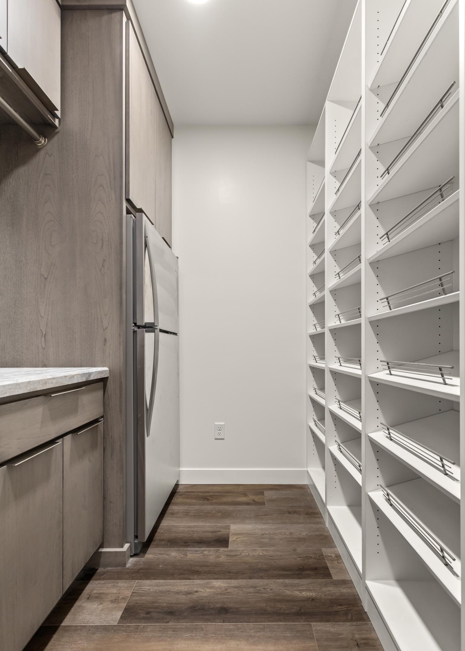 Laundry room with fridge and built ins