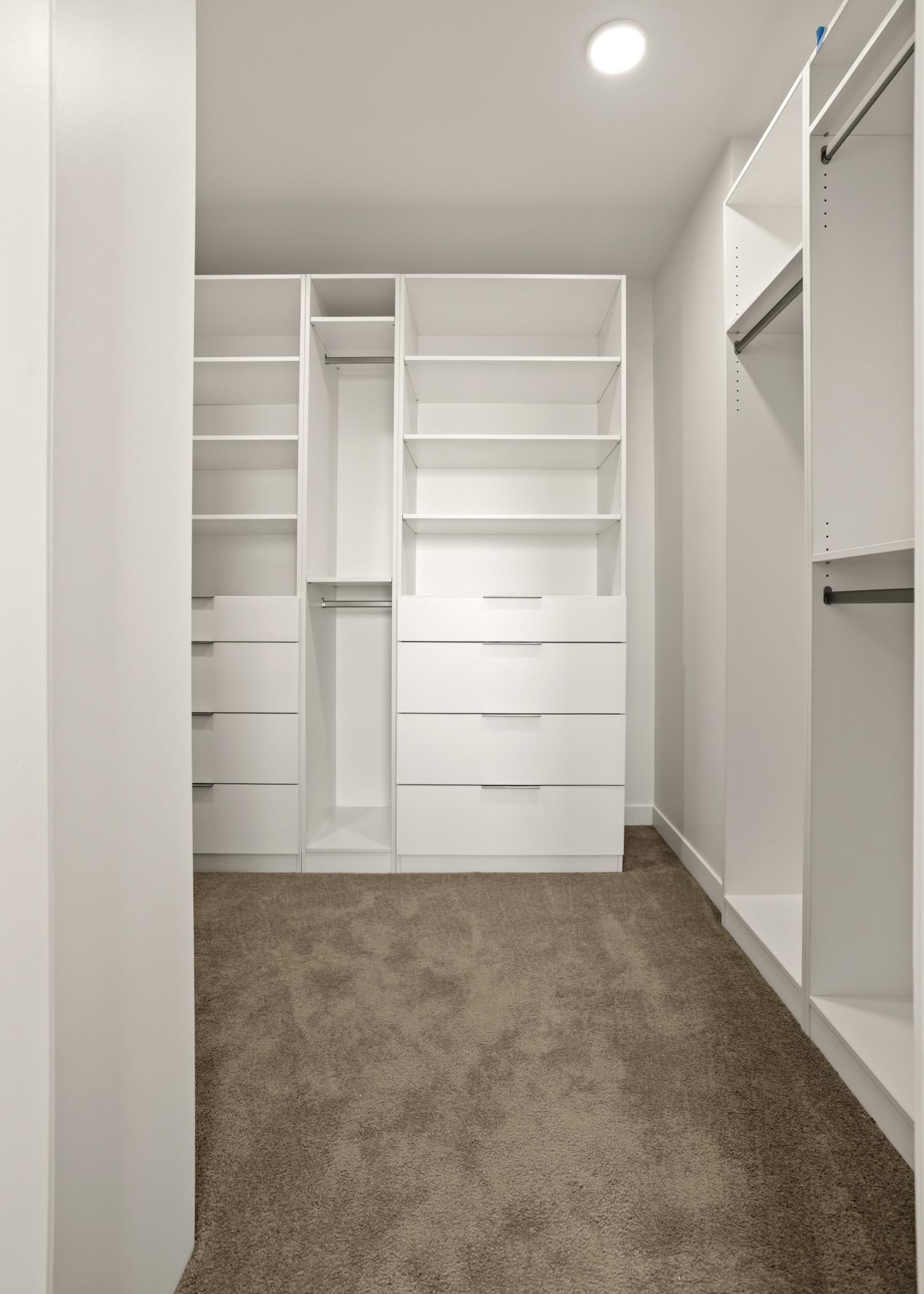 Primary Walk in closet with built ins
