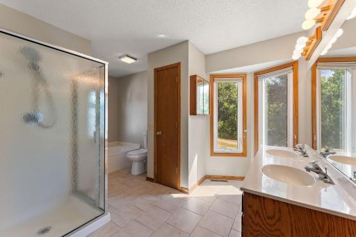 Main floor bath features soaking tub and walk-in shower plus new toilet!!