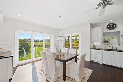 INformal dining steps out to the open air porch and views of the wetlands