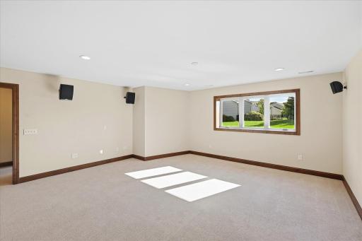 Lower level family room with a framed opening for a gas fireplace. The gas line and and power are in plae.