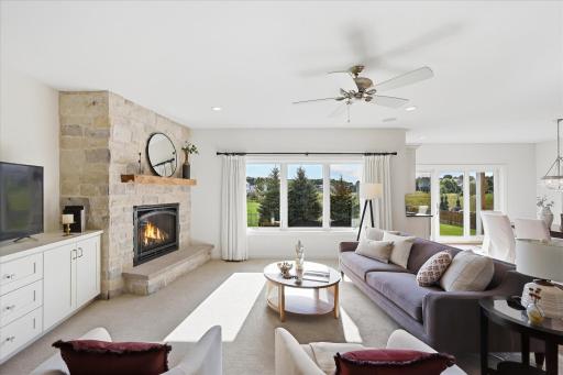 Great room with wall of south facing windows brings in an abundance of light and warmth in the winter season