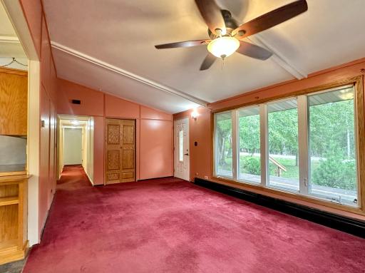 A look back at the entry and living room with bedrooms and baths down the hall.