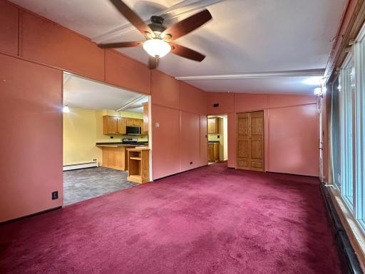 A user friendly layout, this room opens right into the kitchen/dining room and functions very well.