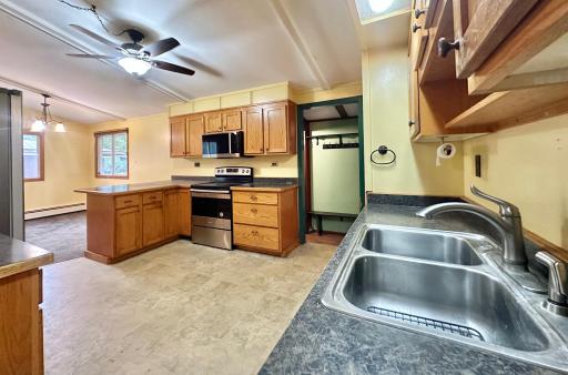 The hall space in the back goes left down stairs and to the right is your backyard access.