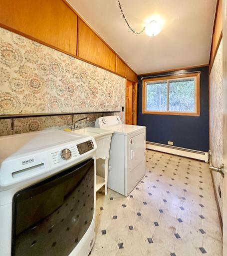 Main level laundry room very close to all bedrooms for your convenience.