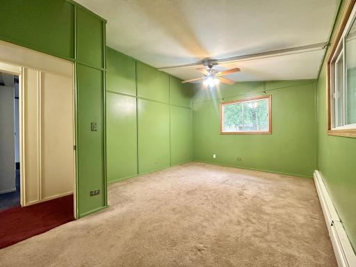 One of three bedrooms with two windows giving this room much natural lighting.
