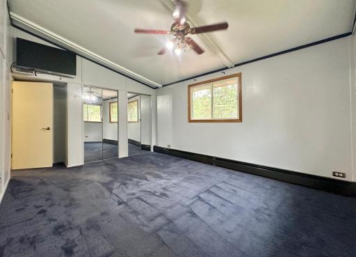 This room has two mirrored closets for the owners.