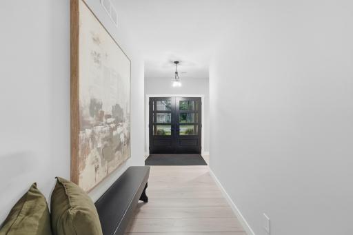 Welcome home! Double-door entry with sightlines from front to back of the home. Everyone fits in foyer as they lace up shoes then linger for a long, Minnesota-goodbye.