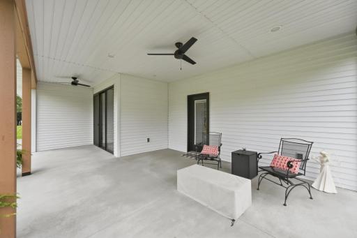 Covered back patio with access from living room, dining room and garage. LED lighting, ceiling fans, electric for future retractable screens, option to finish as 4-season porch. Impressive concrete work, nearly zero cracking and exceptionally clean.