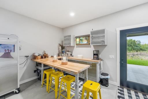Utilize the space as weekend rec room for game-day or poker-night with friends & neighbors. Bayer-Built door with built-in shade leads out to large, covered patio