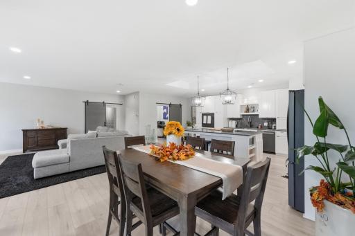 A spacious, airy floor plan brings the great room, dining area and kitchen together while still providing distinct spaces for relaxing, dining and entertaining.