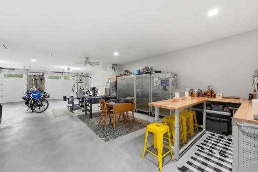 Tandem-style garage easily parks multiple vehicles, tailers, boats, toys or storage. Mechanical room with noise-reducing insulated walls, on-demand water heater, secondary boiler for in-floor heat, air exchanger, water softener. Oversized AC unit.