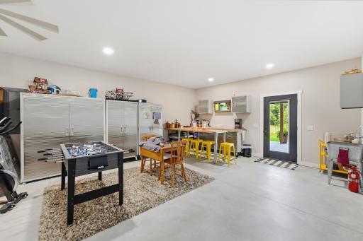 Oversized 3-stall, tandem garage is finished, heated, well-lit, painted and trimmed to feel like an extension of the home. Meticulously clean and comfortable. Walk out to covered back patio.