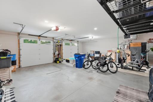 (2) 9'x8' garage doors with upper windows, 9' ceilings, space to fully open car doors and storage along walls. Floor drains to catch winter snow-melt and Reznor heater to evaporate that moisture. Pull-down latter for walk-up attic storage.