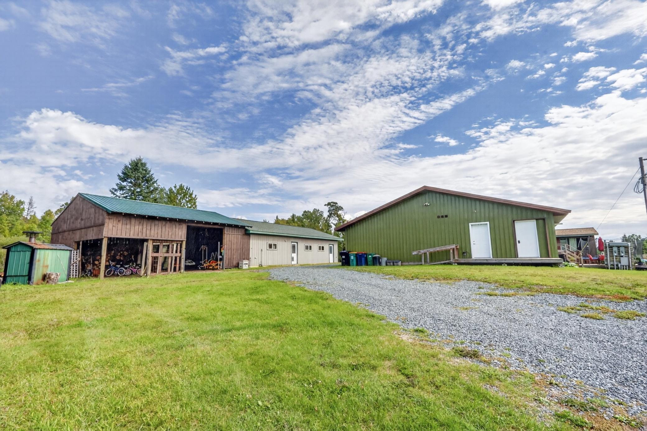 Wood stove, wood shed, garage, back of home