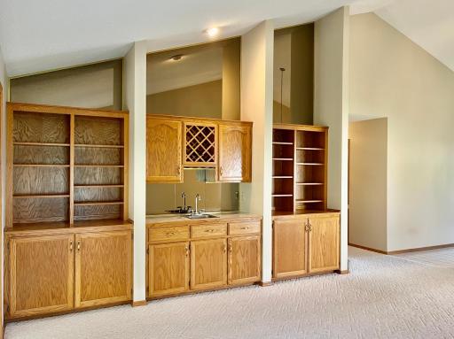 Beautiful built-ins and wet bar. Vaulted ceiling.