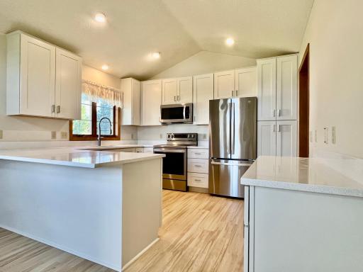 New kitchen, Solid Surface Countertops and LVP flooring.