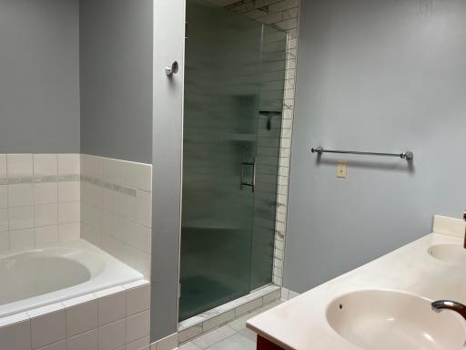 Primary Suite Bathroom. Double sink, shower and tub.