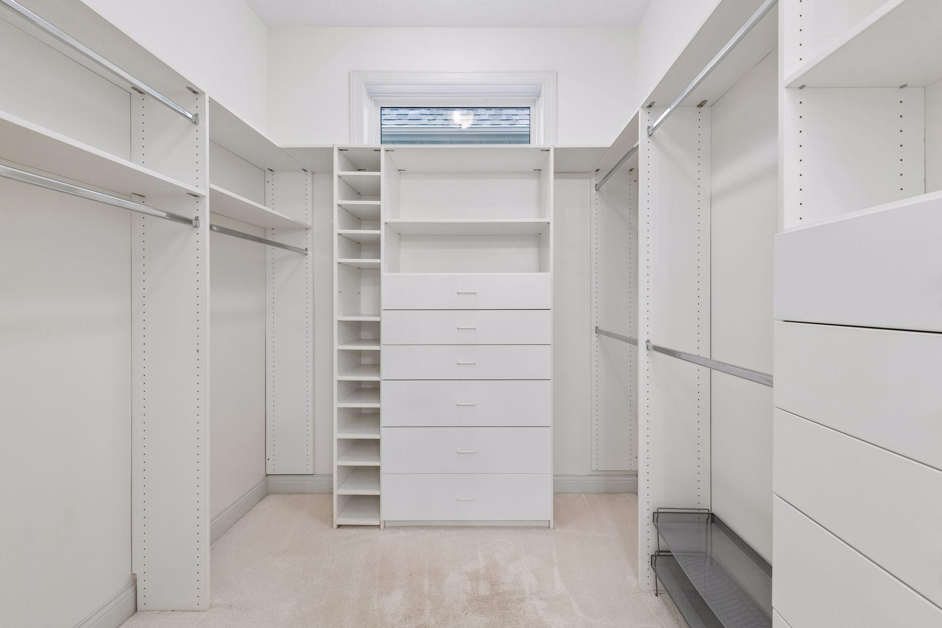Step into the Primary Closet where you will find an extensive custom organizer system.