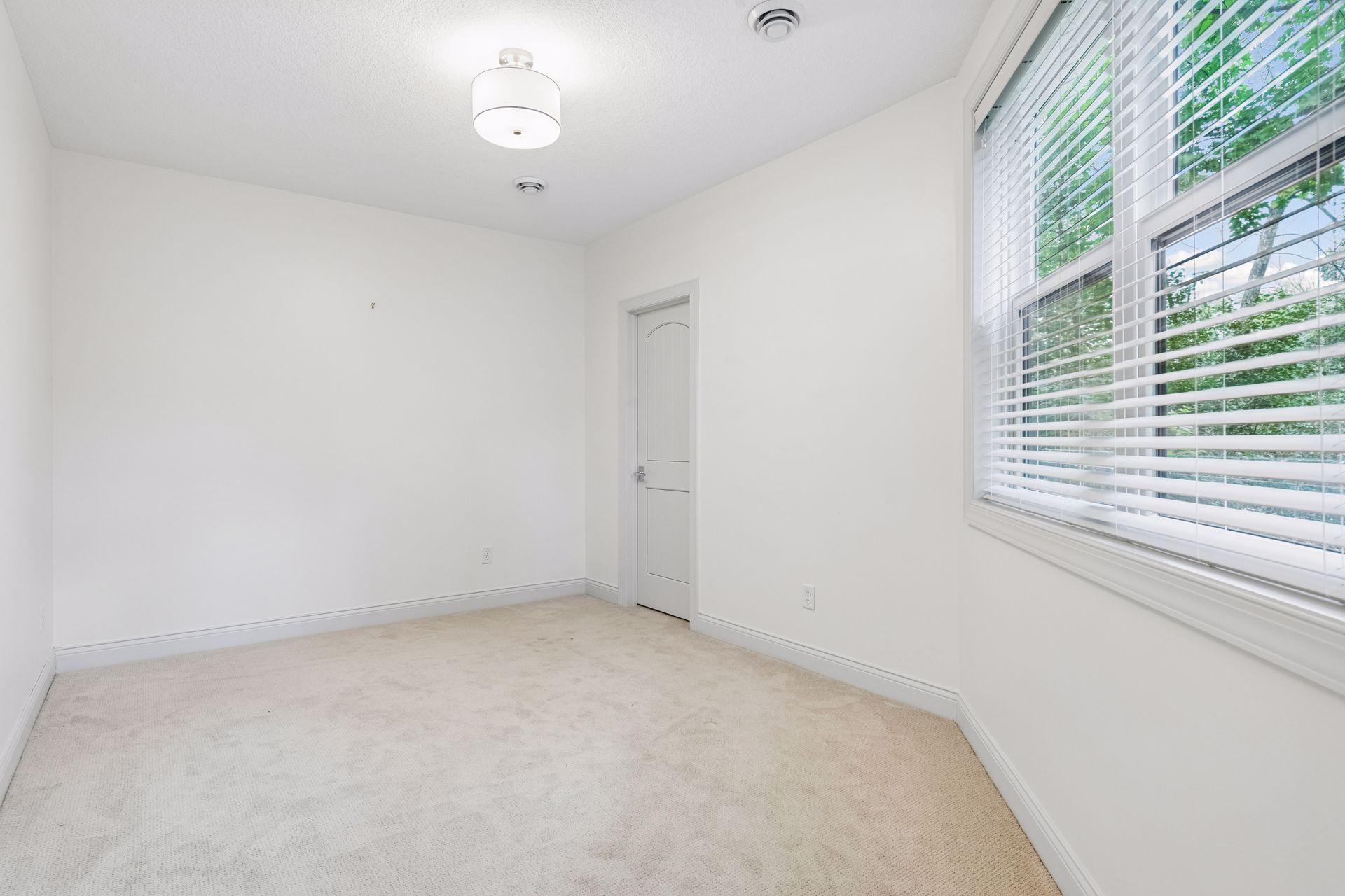 There are two, spacious Junior Bedrooms located in the lower level - this room features a walk-in closet.