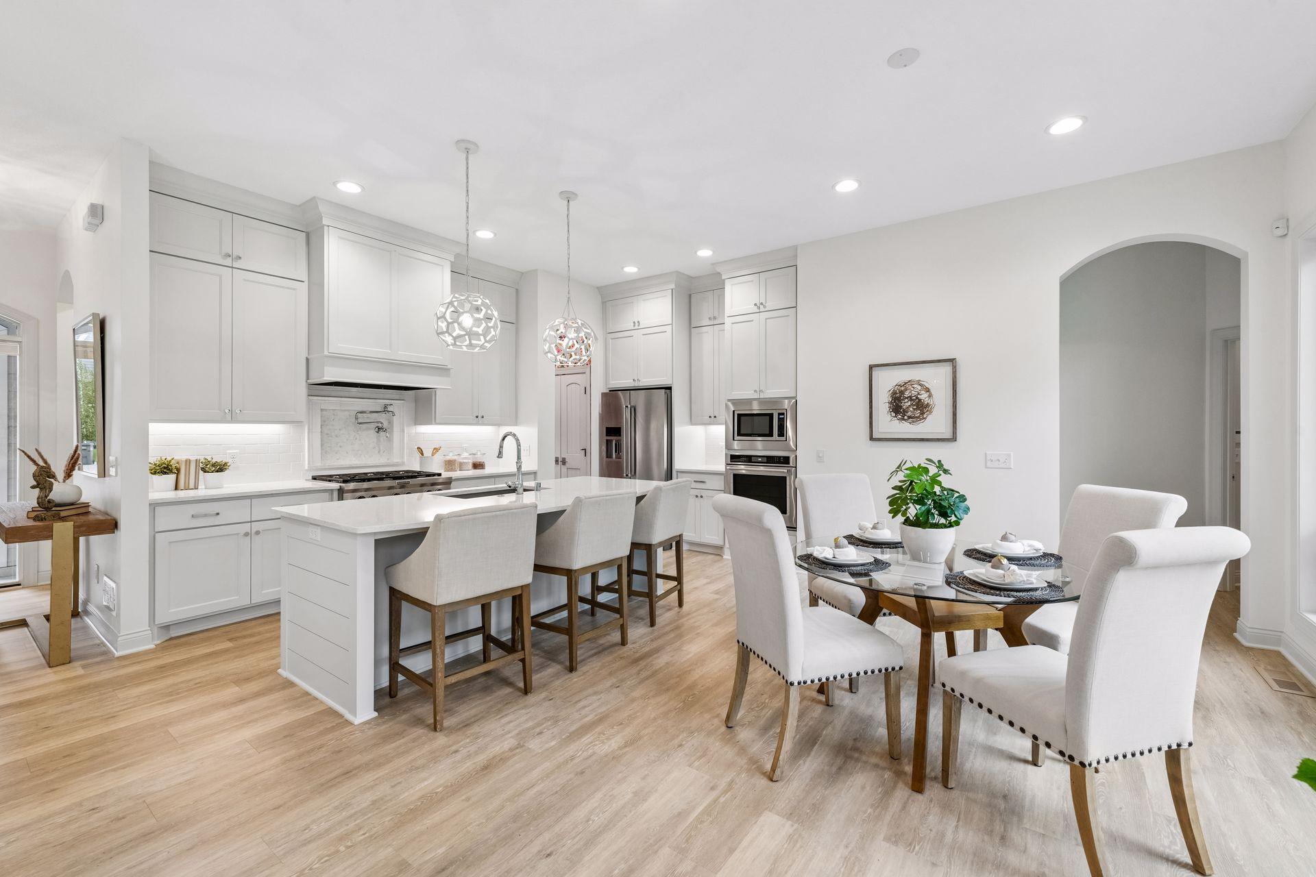 A spacious Kitchen with a large island flows naturally into the Dining Room, with plenty of space for gathering.