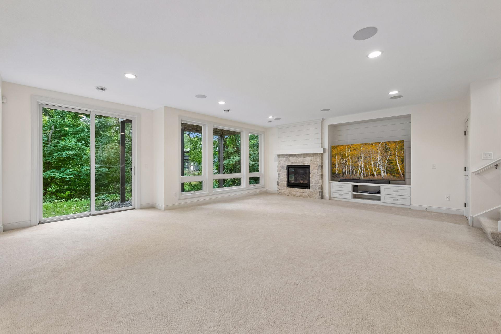 Downstairs, the walkout lower level offers a second Family Room with a gas fireplace and custom entertainment center.