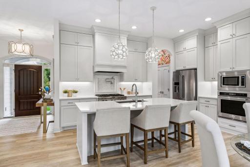 Sure to please any chef! The gourmet Kitchen offers enameled custom cabinetry and quartz countertops.