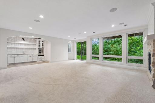 With high ceilings and large windows, you'll enjoy entertaining and relaxing in this lower level.