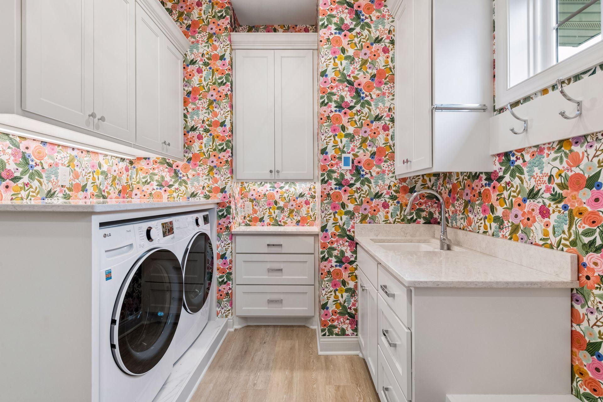 The Mud Room has been completely remodeled with new built-ins, quartz countertops and charming wallpaper.