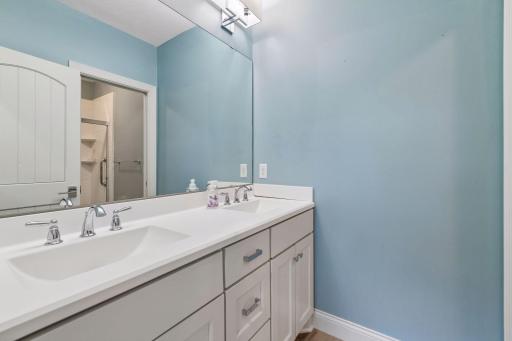 The lower level bathroom has also enjoyed an update with a comfort-height vanity featuring two sinks.